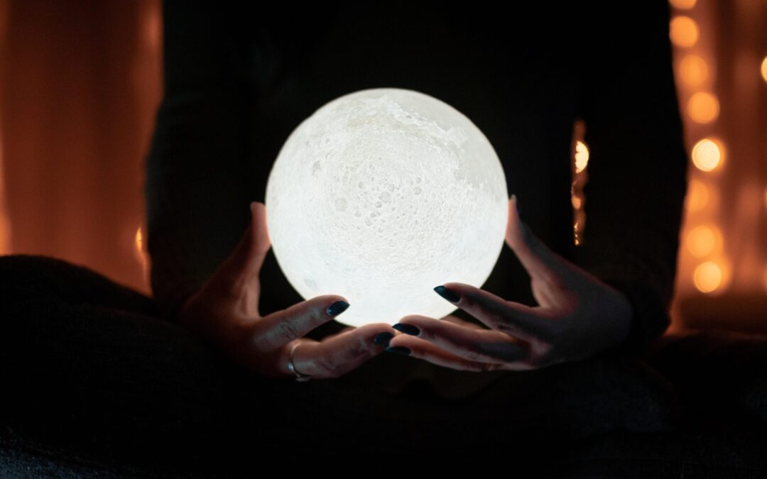person holdong a sphere